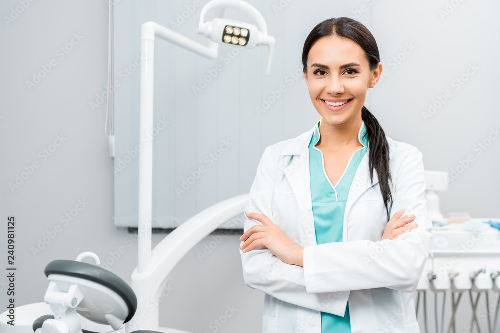 Female dentist monitoring a patient's progress